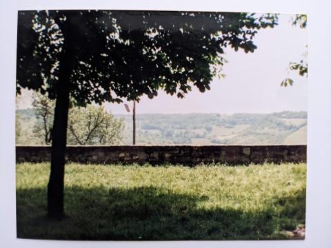 photo taken from a grassy rampart, overlooking green, rolling farmland