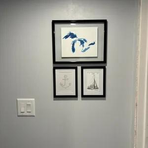 three framed nautical pieces